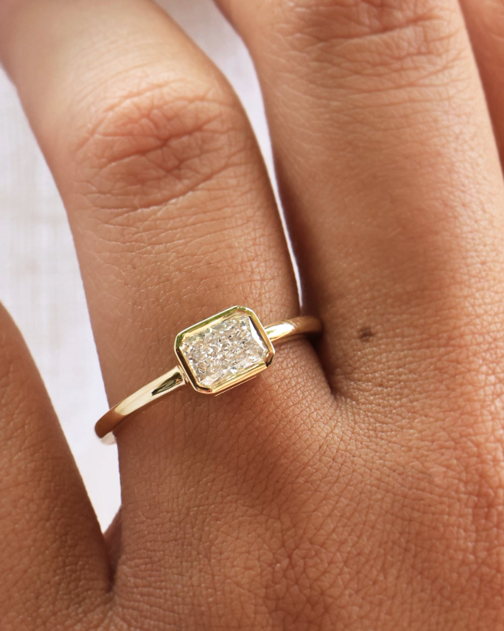 Christine 0.90ct Radiant Diamond East West Bezel Engagement Ring