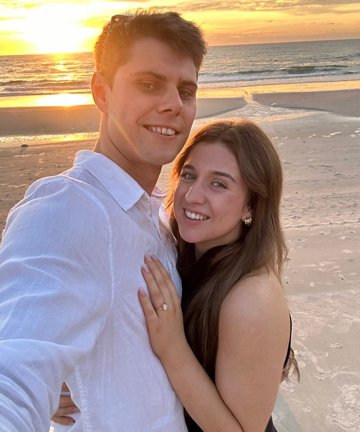 Ellyana and Kyle engagement photo with bespoke Grace engagement ring featuring hidden halo and birthstones