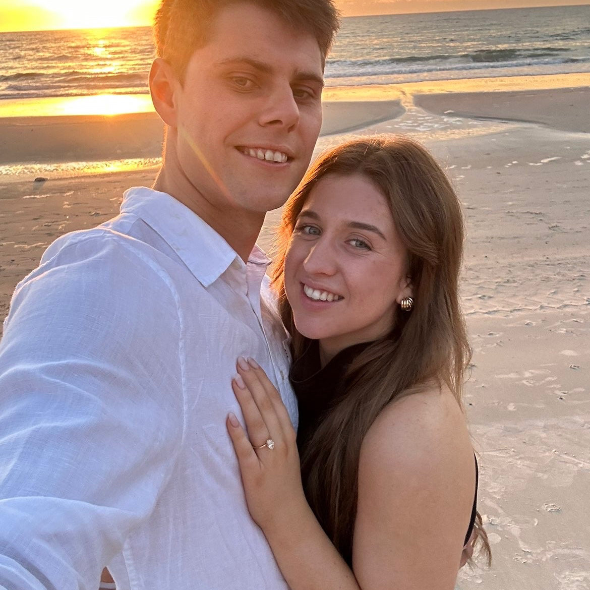 Ellyana and Kyle engagement photo with bespoke Grace engagement ring featuring hidden halo and birthstones