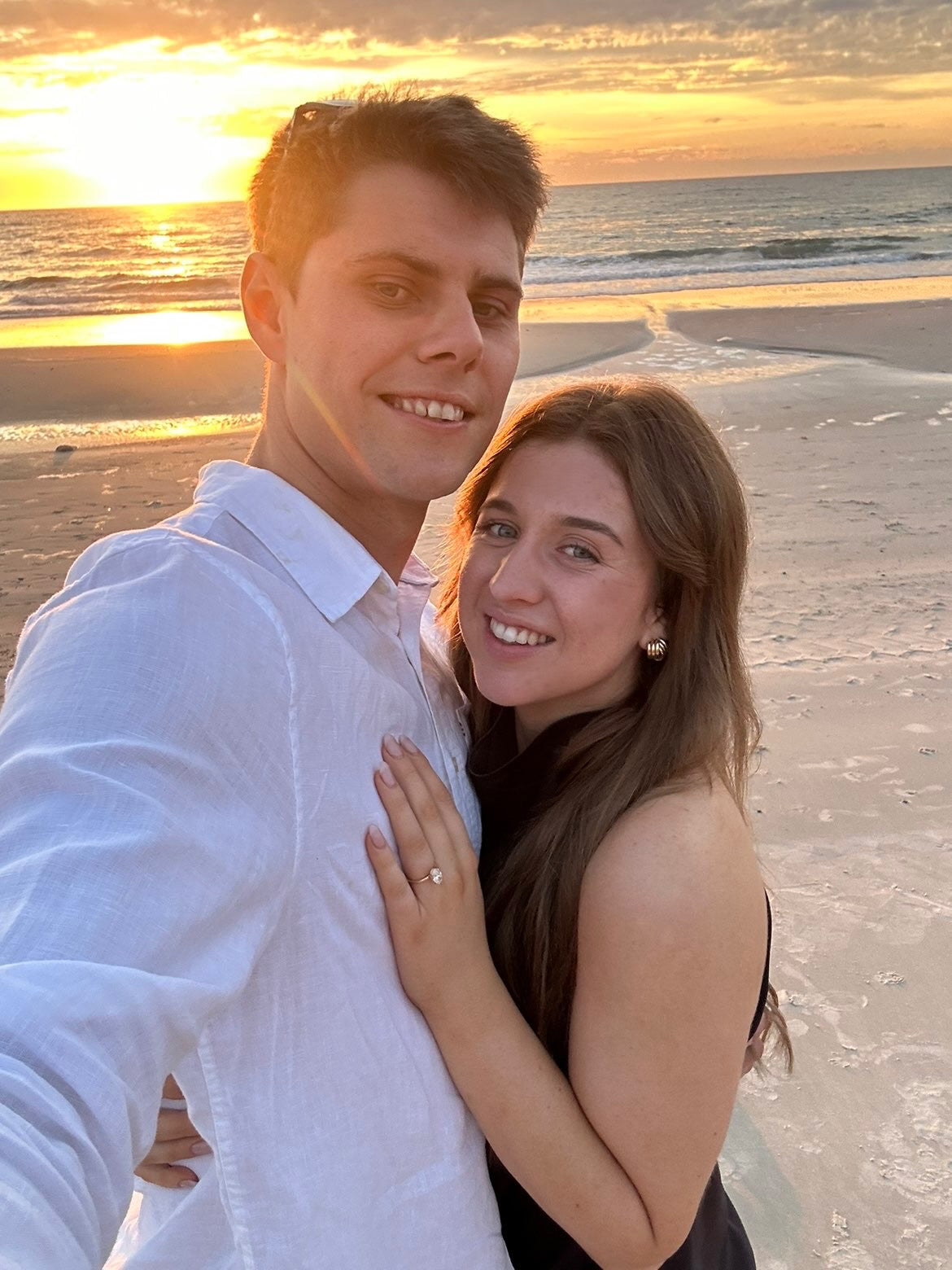 Ellyana and Kyle engagement photo with bespoke Grace engagement ring featuring hidden halo and birthstones