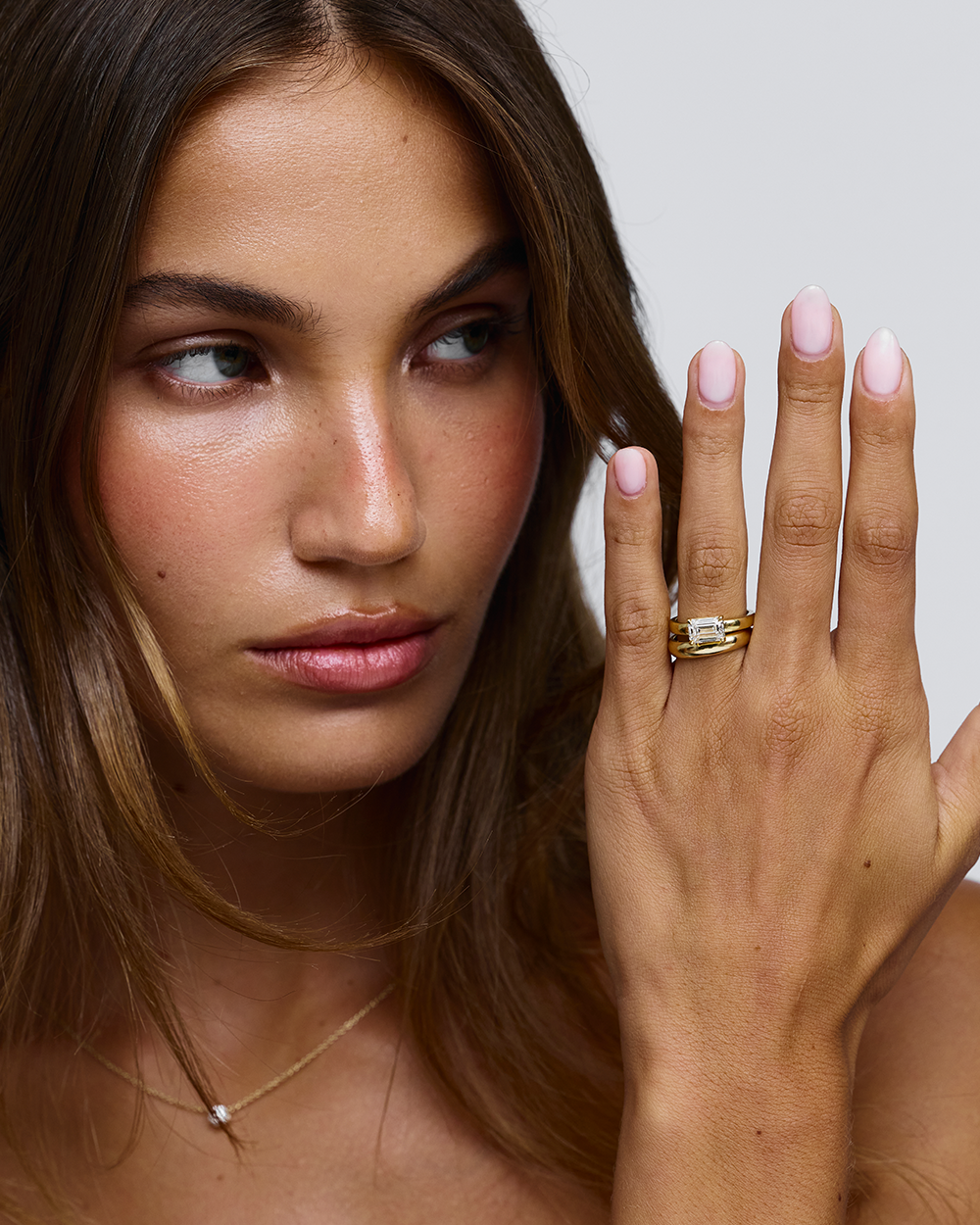 Evelyn ring profile showing flush fit against finger with pale pink manicure