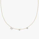 Personalised gold charm necklace with M initial, diamond birthstone and star pendant