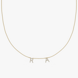 Solid gold personalized charm necklace with diamond-paved initial letters R and A