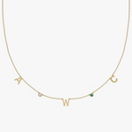 Solid gold personalized charm necklace with initials A, W, C and birthstone gemstones