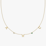 Solid gold personalized charm necklace with initials A, W, C and birthstone gemstones