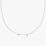 Yellow gold charm necklace with diamond and letter F initial pendant