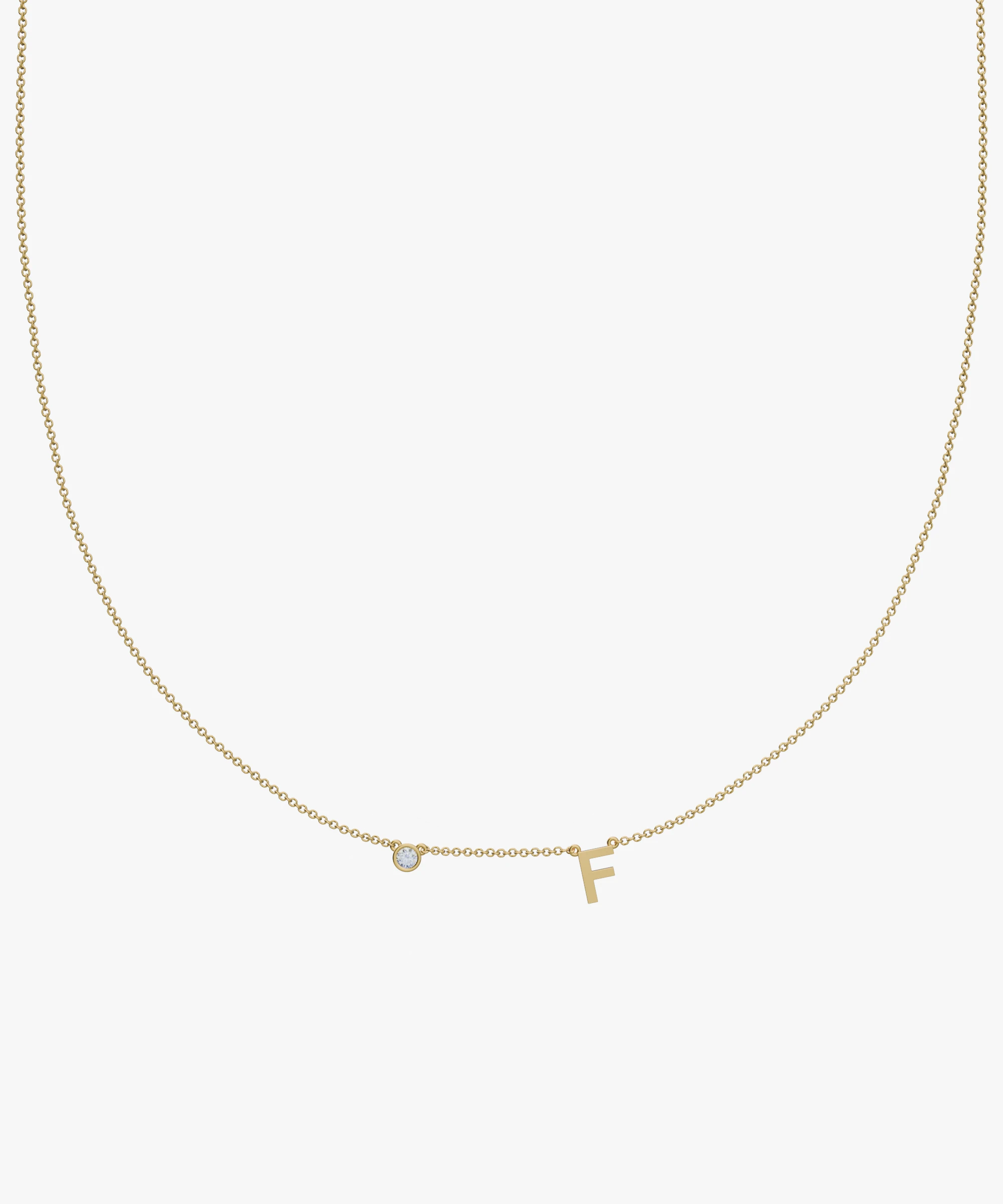 Yellow gold charm necklace with diamond and letter F initial pendant