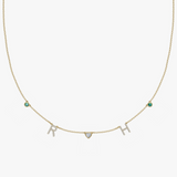 Yellow gold charm necklace with pave diamond initials RH, heart and teal birthstone charms