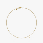 Yellow gold charm bracelet with birthstone and letter D initial