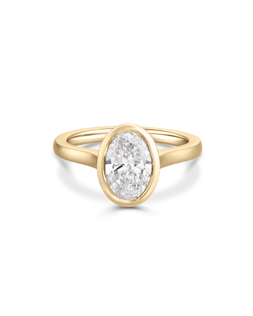Isolated 18ct yellow gold oval diamond bezel engagement ring with smooth tapered band