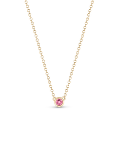 Yellow gold birthstone necklace with soft pink sapphire or spinel pendant