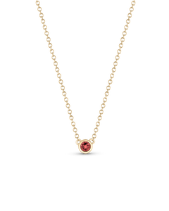Pink faceted birthstone pendant in bezel setting on gold chain