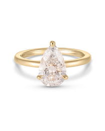 Yellow gold pear diamond ring three prong setting smooth polished band