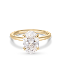 Top down view of 18ct yellow gold oval diamond solitaire ring with prongs