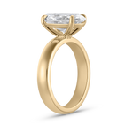 Side profile of Harper oval diamond ring showing thick polished 18ct yellow gold band and elevated prong setting