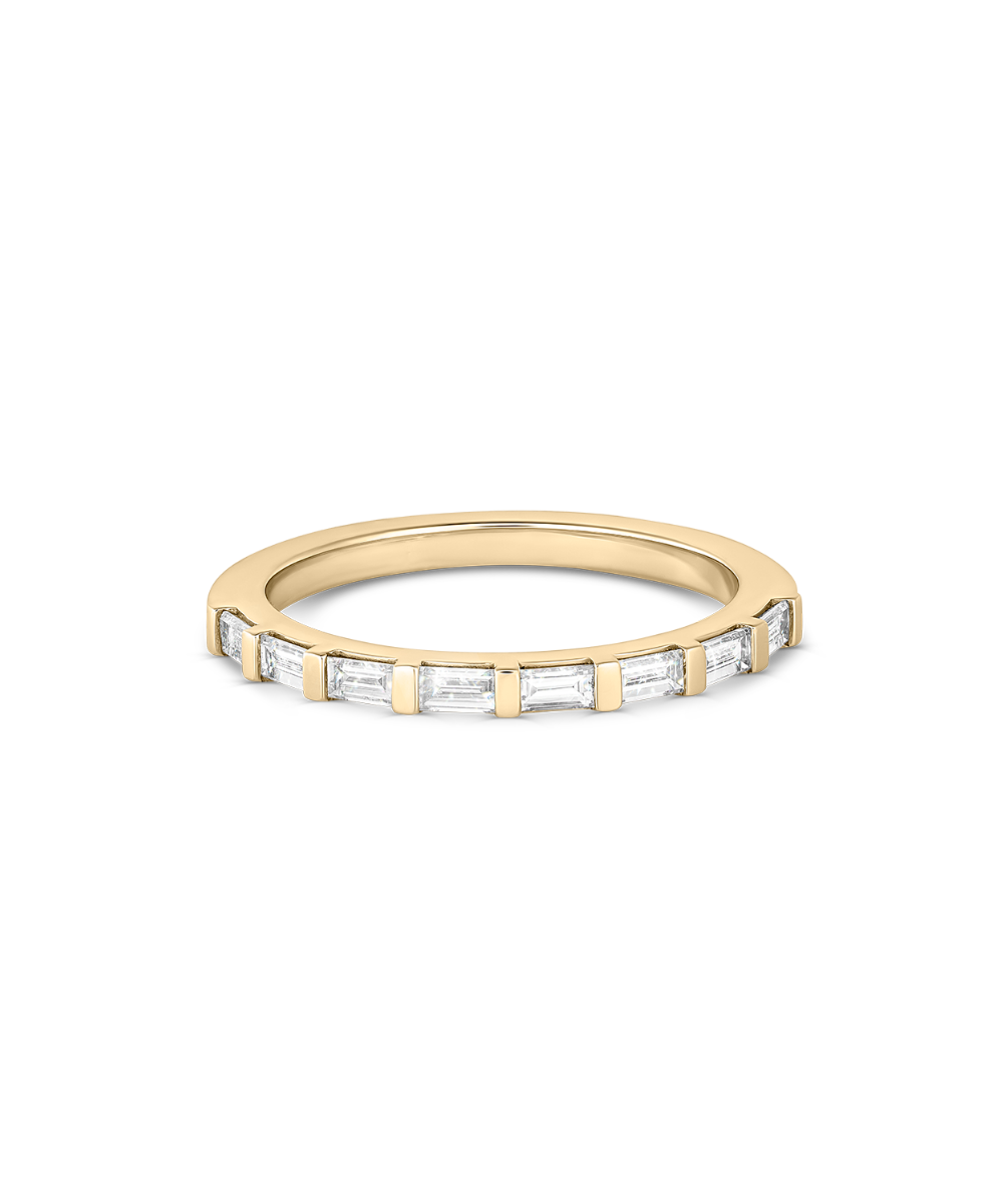 Top-down detail of eight baguette cut lab grown diamonds in yellow gold claw setting