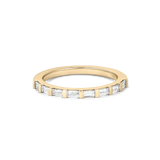 Top-down detail of eight baguette cut lab grown diamonds in yellow gold claw setting