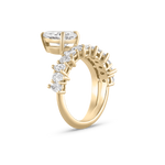 Gold pear diamond engagement ring side profile showing prong settings