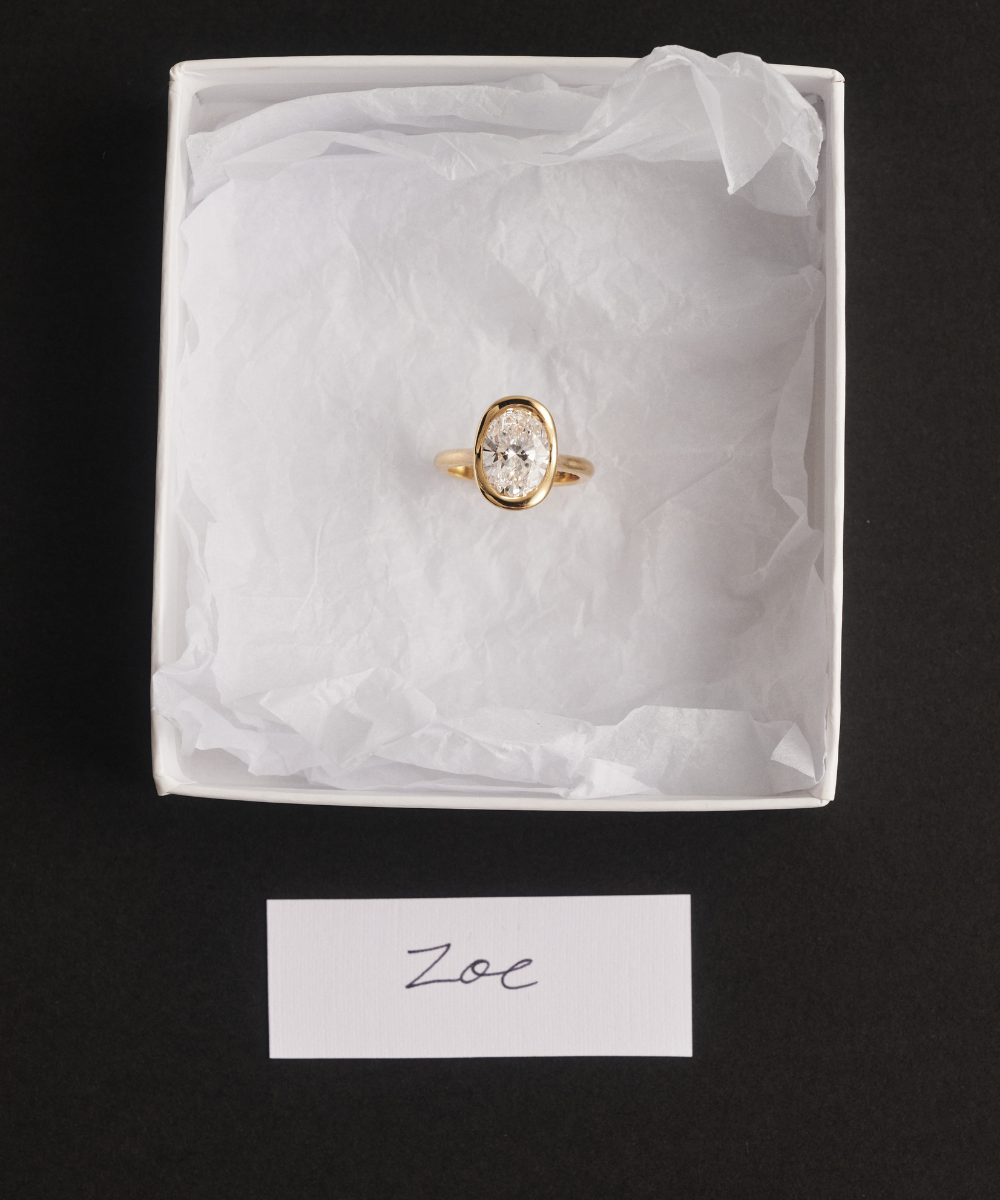 Zoe Oval Bezel Ring in white gift box with handwritten 'Zoe' card for engagement