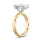 Close-up of two-tone marquise diamond ring structure with domed yellow gold band