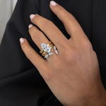 Two-tone marquise diamond engagement ring styled with matching wedding band set