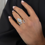 Two-tone marquise diamond engagement ring styled with matching wedding band set