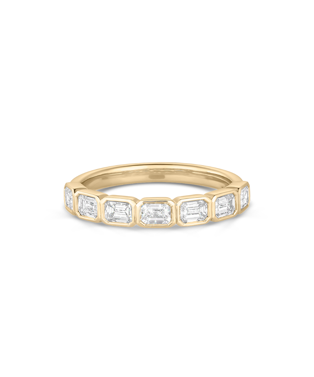Top-down view of Nina East-West Emerald Bezel Diamond Ring showing geometric diamond setting