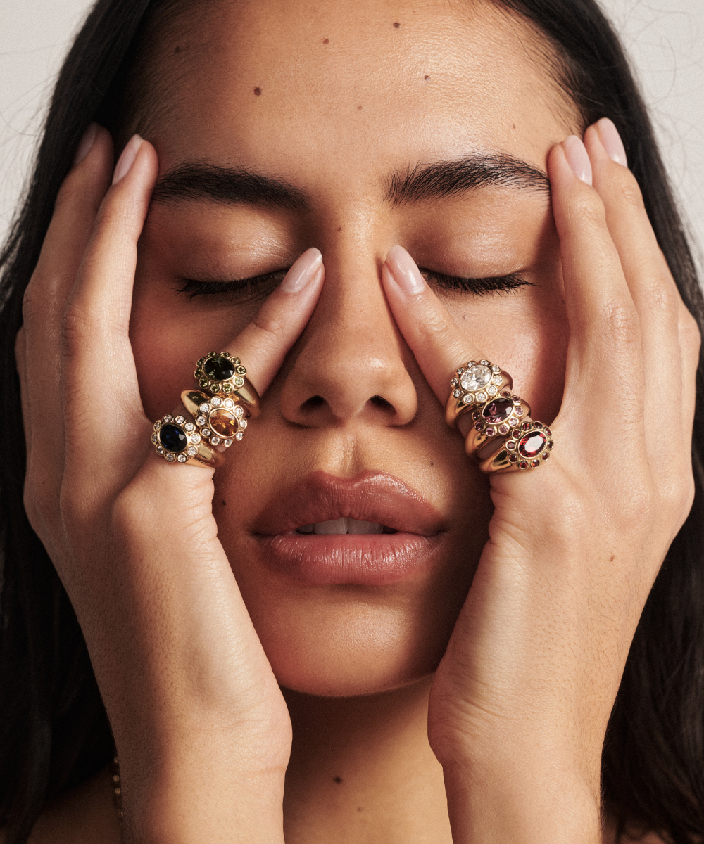 Ophelia Pinky Ring with emerald, orange-brown, black, clear, purple and red oval gemstones in gold with diamond halos
