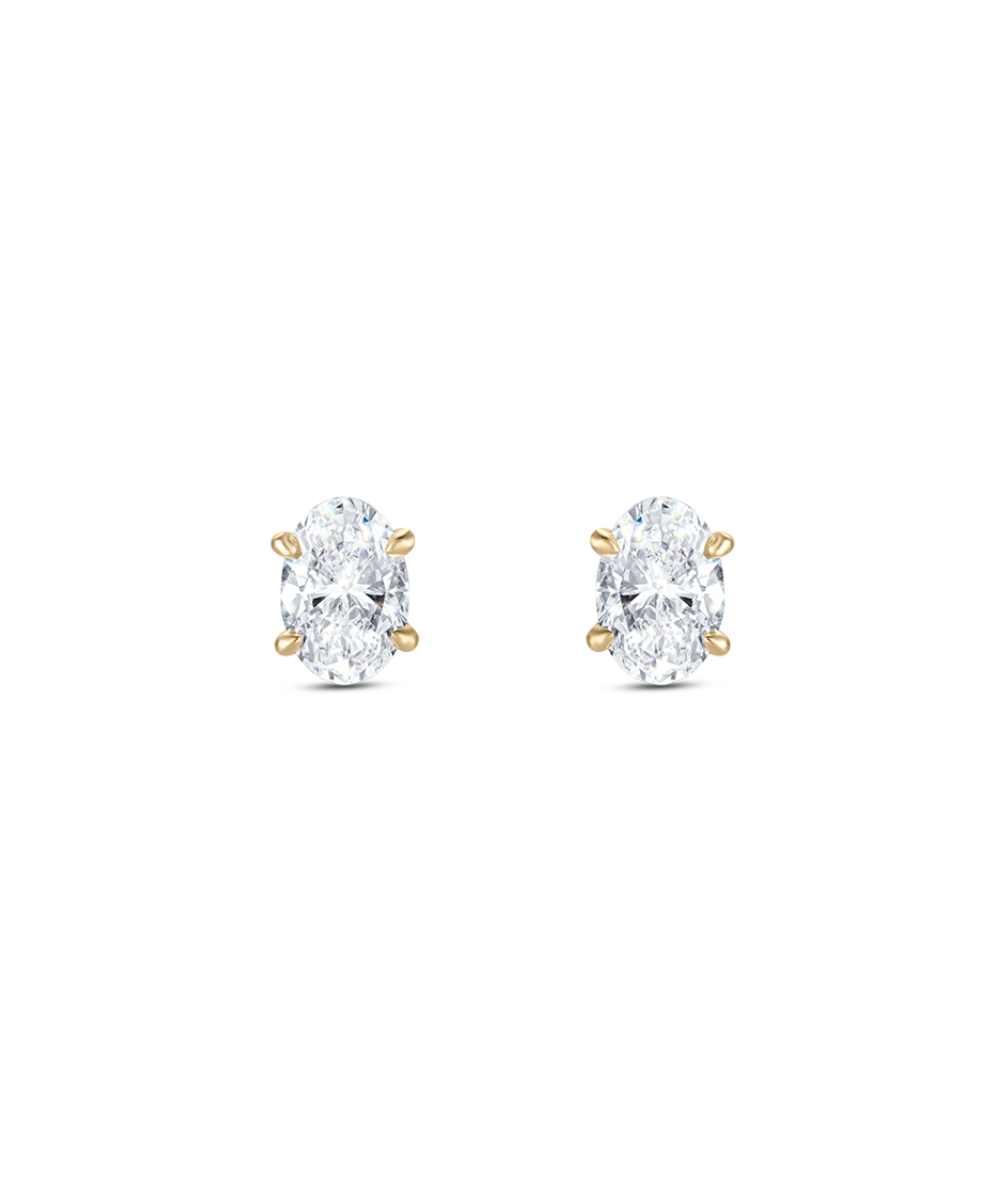 Pair of yellow gold oval diamond stud earrings side-by-side