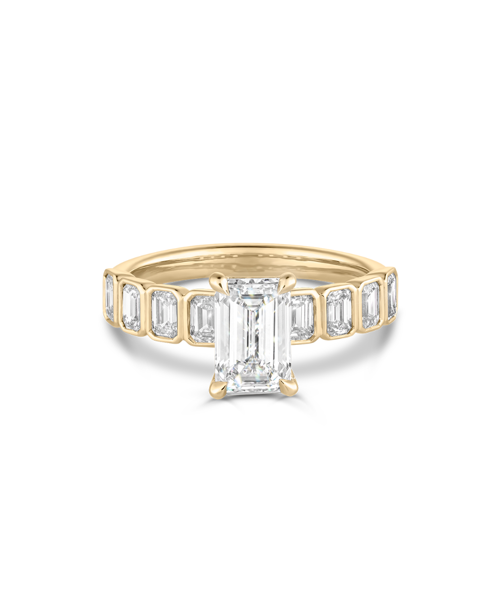 18ct yellow gold emerald cut diamond engagement ring with bezel setting