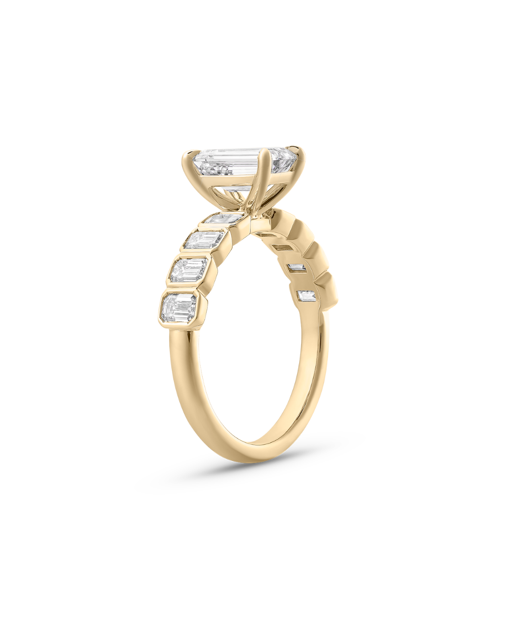 Side view of geometric bezel setting on 18ct yellow gold diamond band
