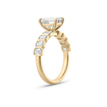 Side view of geometric bezel setting on 18ct yellow gold diamond band