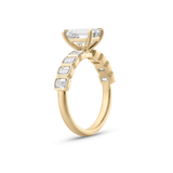 Side view of geometric bezel setting on 18ct yellow gold diamond band