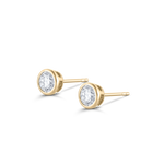 Yellow gold round diamond stud earrings showing back mechanism