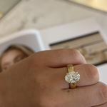 Seraphine 18ct yellow gold oval diamond engagement ring worn on finger