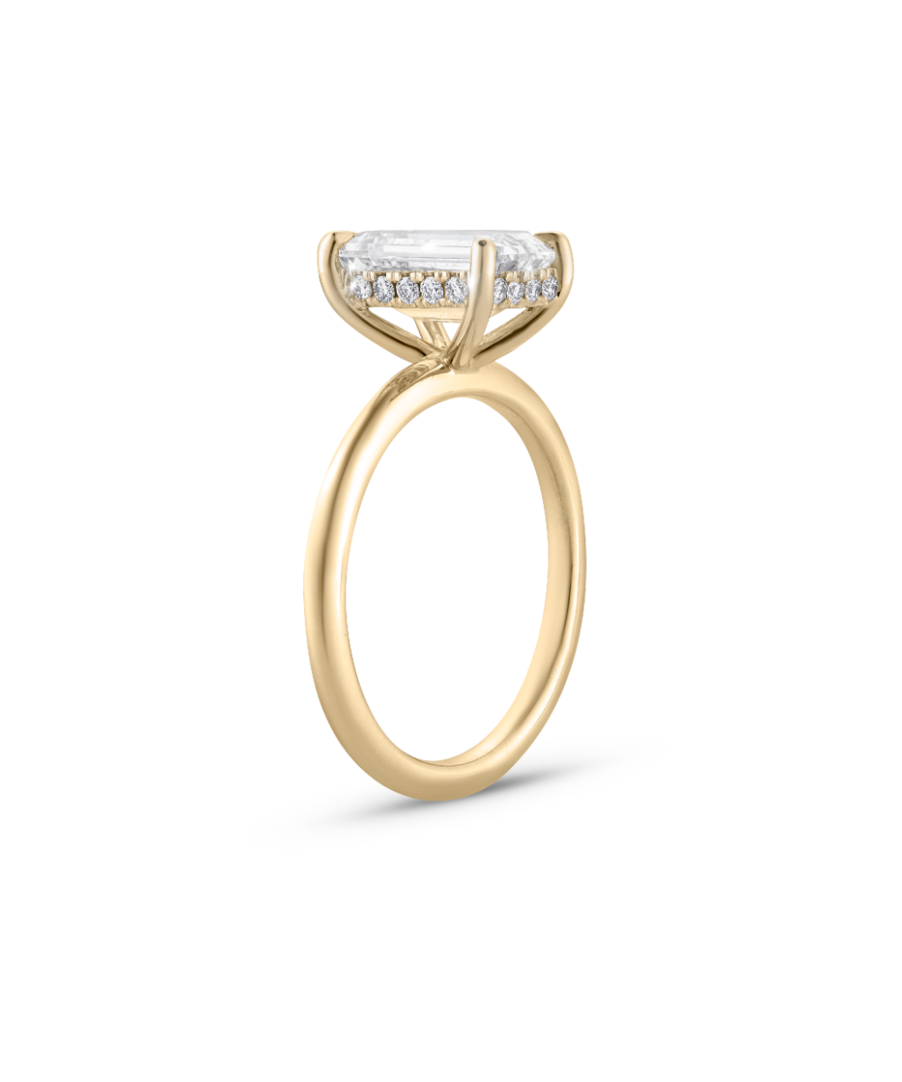18ct yellow gold emerald cut diamond engagement ring with hidden halo detail