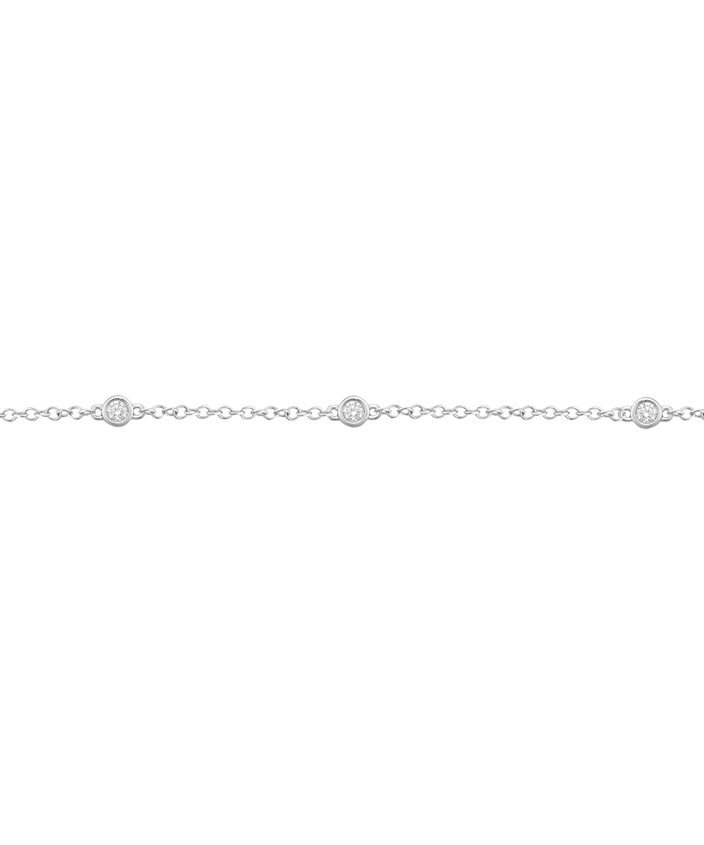 Studio shot of silver-toned chain with three bezel-set diamonds
