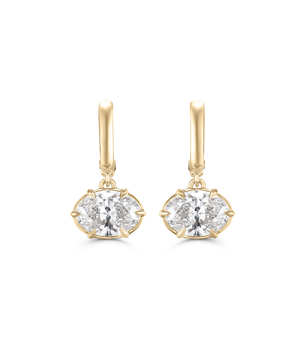 Front view of gold Victoria huggie earrings with six-prong oval gemstone settings
