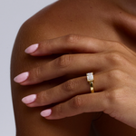 Side profile of 18ct yellow gold solitaire ring with horizontal emerald cut diamond