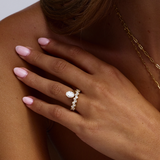 Close-up of 18ct yellow gold oval diamond engagement ring with 15-stone channel-set side band