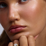 Arabella oval lab grown diamond engagement ring in 18ct yellow gold worn on hand