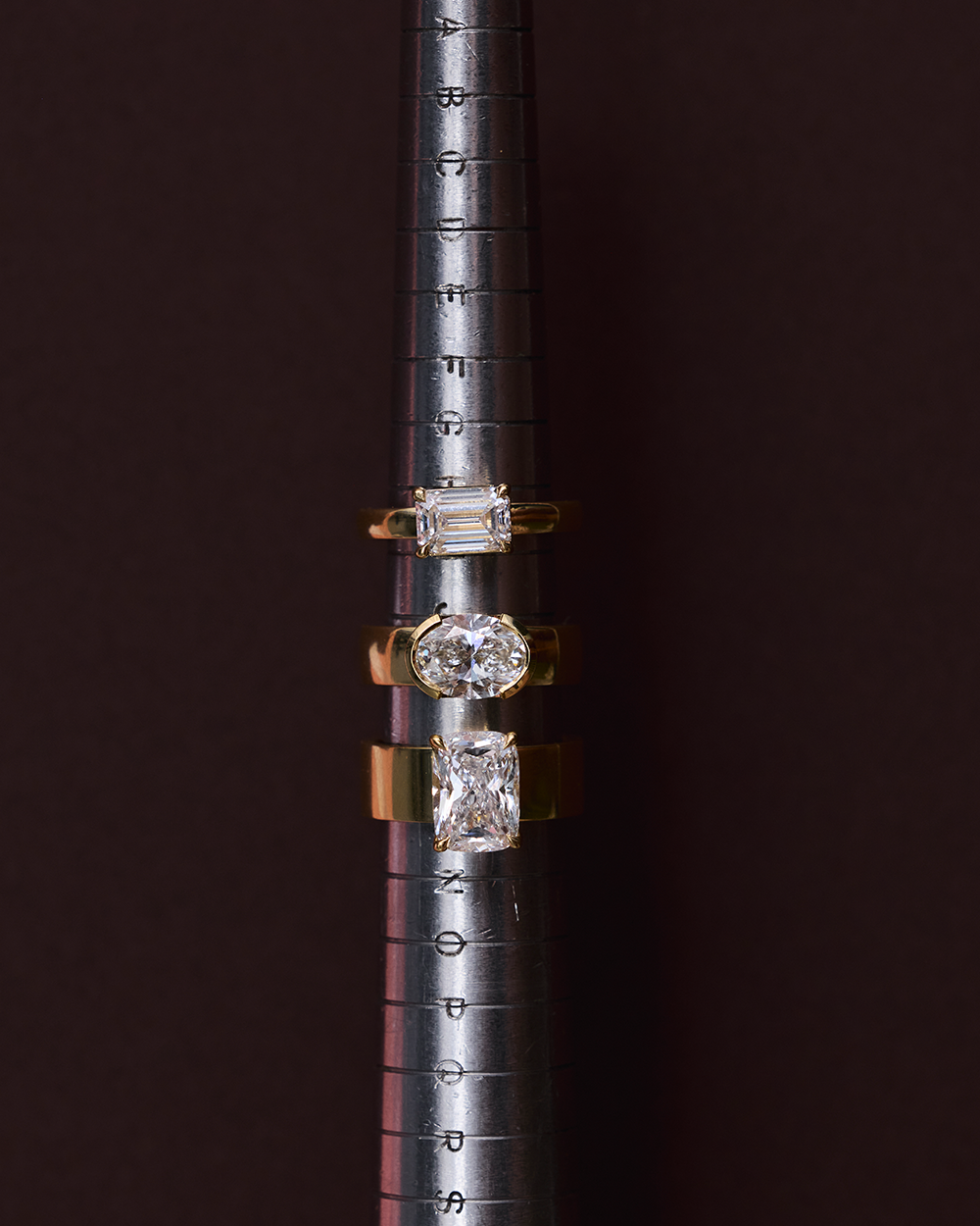Arabella east-west oval diamond ring size comparison with baguette and cushion cuts
