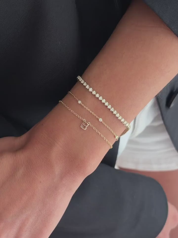 Swipe for wrist stack inspo, starting with one for the white gold girlies 🤍 

Pictured from top to bottom:
1. Phia Bangle 
2. 4.74 Tennis Bracelet 
3. Personalised Charm Bracelet 

A diamond multicut moment

Pictured from left to right:
1. Multicut Diamond Charm Bracelet 
2. Base Chain
3. Multicut Bezel Tennis Bracelet 

A subtle diamond stack 

Pictured from top to bottom:
1. Petite Tennis Bracelet 
2. Stardust Bracelet 
3. Initial Bracelet 

The staple, everyday day stack 

Pictured from left to right: 
