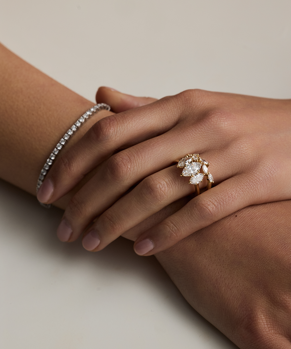 18ct yellow gold marquise trilogy engagement ring with lab grown diamonds on hand